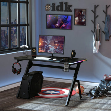 RGB 120 x 66cm Gaming Desk, Computer Table with Carbon Fibre Surface, Headphone Hook, Cup Holder, Controller Rack, Home Office Desk, Black